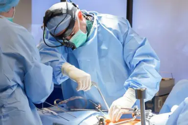 Dr. Sumit Kumar Jha performing complex orthopedic surgery in a sterile operation theatre in Siliguri